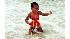 This photo provided by the presidential campaign of Sen. Barack Obama, D-Ill., shows a young Barack Obama playing in the ocean in the 1960s. (AP Photo/Obama Presidential Campaign)