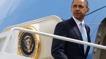 President Barack Obama boards Air Force One at Andrews Air Force Base, Md., Tuesday, May 10, 2011, as he travels to the U.S.-Mexico border at El Paso, Texas, to speak about immigration reform, Tuesday, May 10, 2011. (AP Photo/Charles Dharapak)