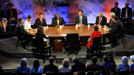 Republican presidential candidates from left facing camera, former Utah Gov. Jon Huntsman, Rep. Michele Bachmann, R-Minn., Texas Gov. Rick Perry, businessman Herman Cain, former Massachusetts Gov. Mitt Romney, Rep. Ron Paul, R-Texas, former House Speaker Newt Gingrich and former Pennsylvania Sen. Rick Santorum participate in a presidential debate at Dartmouth College in Hanover, N.H., Tuesday, Oct. 11, 2011. (AP Photo/Toni Sandys, Pool)