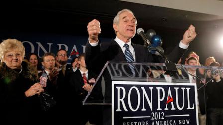 Republican presidential candidate Rep. Ron Paul, R-Texas, speaks at his caucus night rally, Tuesday, Jan. 3, 2012, in Ankemy, Iowa. Pauls wife, Carol, is at left.(AP Photo/Eric Gay)