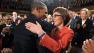President Barack Obama embraces retiring Rep. Gabrielle Giffords, D-Ariz., as members of Congress applaud before his State of the Union address in front of a joint session of Congress Tuesday, Jan. 24, 2012, on Capitol Hill in Washington.