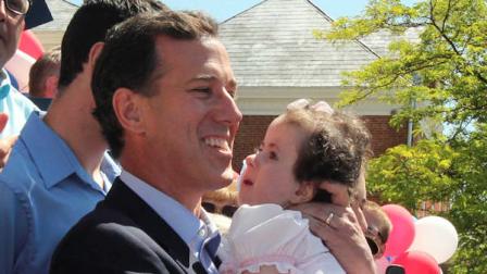 Former Pennsylvania Sen. Rick Santorum holds his daughter Isabella before announcing he is entering the Republican presidential race, Monday, June 6, 2011, on the steps of the Somerset County Courthouse in Somerset, Pa. (AP Photo/Gene J. Puskar)