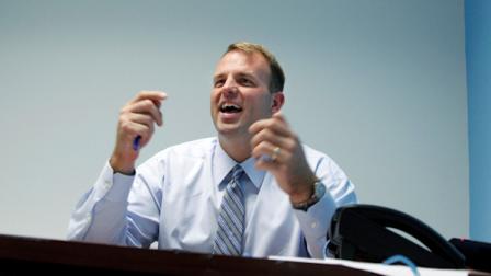 Former Philadelphia Eagles football star, Republican Rep. Jon Runyan laughs as he answers a question at his campaign headquarters in Marlton, N.J., Wednesday, Oct. 10, 2012. (AP Photo/Mel Evans)
