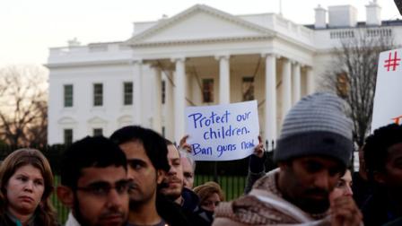 Supporters of gun control gather on Pennsylvania Avenue in front of the White House in Washington, Friday, Dec. 14, 2012, during a vigil for the victims of the shooting at Sandy Hook Elementary School in Newtown, Ct., and to call on President Obama to pass strong gun control laws.
