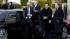 Vice President Joe Biden pulls off his scarf as...