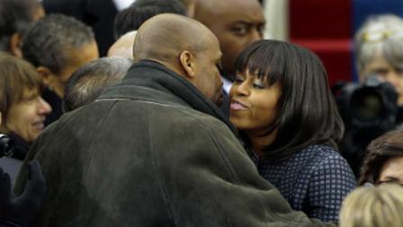 First lady Michelle Obama is greeted by her brother Craig Robinson at the ceremonial swearing-in for President Barack Obama at the U.S. Capitol during the 57th Presidential Inauguration in Washington, Monday, Jan. 21, 2013. (AP Photo/Pablo Martinez Monsivais)