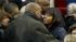 First lady Michelle Obama is greeted by her...