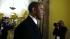 President Barack Obama walks through the Capitol...