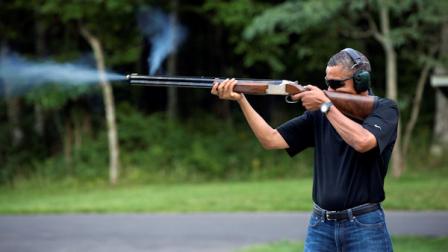 In this photo released by the White House, President Barack Obama shoots clay targets on the range at Camp David, Md., Saturday, Aug. 4, 2012. The White House released a photo of Obama firing a gun, two days before he heads to Minnesota to discuss gun control. In a recent interview with The New Republic magazine, Obama said yes when asked if he has ever fired a gun. He said we do skeet shooting all the time, except for his daughters, at Camp David. (AP Photo/The White House, Pete Souza)