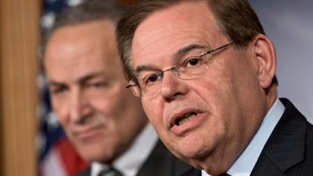 FILE - In this Monday, Jan. 28, 2013 file photograph, Sen. Robert Menendez, D-N.J., right, and Sen. Charles Schumer, D-N.Y., left, announce with other senators that they have reached agreement on the principles of sweeping legislation to rewrite the nations immigration laws, during a news conference at the Capitol in Washington. (AP Photo/J. Scott Applewhite, File)