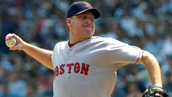 This is an Aug. 30, 2007, file photo showing Boston Red Sox pitcher Curt Schilling delivering a pitch during MLB baseball action against the New York Yankees, at Yankee Stadium in New York. Schilling says hes retiring from baseball. The 42-year-old right-hander who won World Series championships with Arizona and Boston announced on his blog Monday March 23, 2009, that hes leaving after 23 years with zero regrets. (AP Photo/Bill Kostroun, File)