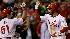 Philadelphia Phillies' Pedro Feliz is congratulated by Carlos Ruiz after hitting a solo home run against New York Yankees' Joba Chamberlain during the eighth inning of Game 4 of the Major League Baseball World Series Sunday, Nov. 1, 2009, in Philadelphia. (AP Photo/David J. Phillip)  