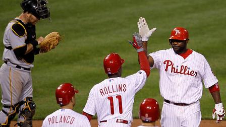 Philadelphia Phillies Ryan Howard, top right, celebrates with teammates Jimmy Rollins (11), Shane Victorino (8) and Placido Polanco (27) after Howards grand slam off Pittsburgh Pirates Jack Taschner in the eighth inning.