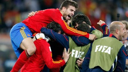 Spains Gerard Pique celebrates with teammates at the end of the World Cup semifinal soccer match between Germany and Spain at the stadium in Durban, South Africa, Wednesday, July 7, 2010. Spain won 1-0.