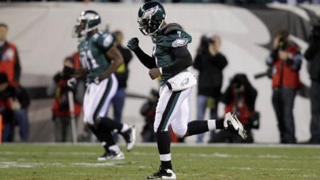 Philadelphia Eagles quarterback Michael Vick celebrates after scoring during the first half of an NFL football game against the New York Giants in Philadelphia, Sunday, Nov. 21, 2010. (AP Photo/Rob Carr)