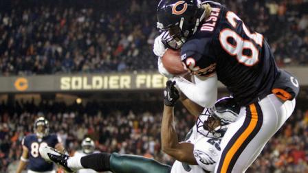 Chicago Bears tight end Greg Olsen (82) makes a touchdown reception against Philadelphia Eagles cornerback Dimitri Patterson (23) in the second half of an NFL football game in Chicago, Sunday, Nov. 28, 2010. (AP Photo/Nam Y. Huh)