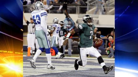 Philadelphia Eagles Michael Vick (7) scores a touchdown as Dallas Cowboys Gerald Sensabaugh reacts during the first half of an NFL football game, Sunday, Dec. 12, 2010, in Arlington, Texas. (AP Photo/Tony Gutierrez)