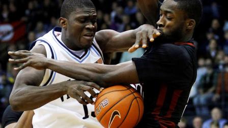Villanovas Mouphtaou Yarou, left, and Temples Micheal Eric look to get control of a rebound in the first half of an NCAA college basketball game, Thursday, Dec. 30, 2010, in Villanova, Pa. (AP Photo/Matt Slocum)