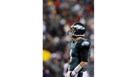 Philadelphia Eagles Kevin Kolb looks up through falling sleet during a time-out in the first half of an NFL football game against the Dallas Cowboys, Sunday, Jan. 2, 2011, in Philadelphia. (AP Photo/Matt Slocum)