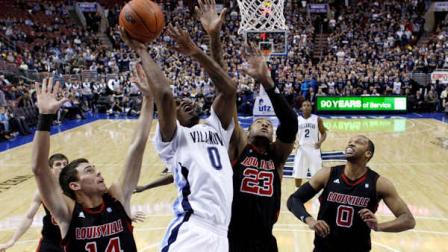 Villanovas Antonio Pena (0) goes up for a shot against Louisvilles Kyle Kuric (14), Terrence Jennings (23) and George Goode (0) in the first half of an NCAA college basketball game Wednesday, Jan. 12, 2011, in Philadelphia. (AP Photo/Matt Slocum)