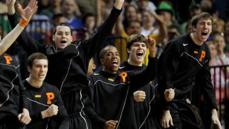 Players on the Princeton bench celebrate as they tie the score during the first half of an East Regional second round NCAA tournament college basketball game against Kentucky in Tampa, Fla., Thursday, March 17, 2011. (AP Photo/John Raoux)