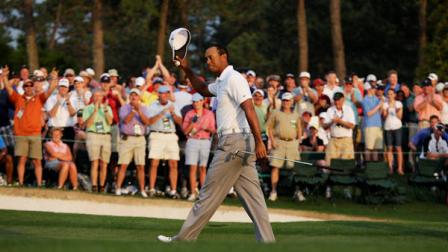 Tiger Woods tips his cap after finishing the second round of the Masters golf tournament Friday, April 8, 2011, in Augusta, Ga. (AP Photo/Charlie Riedel)