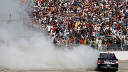 Matt Kenseth does a burnout after winning the NASCAR Sprint Cup Series auto race, Sunday, May 15, 2011, at Dover International Speedway in Dover, Del. (AP Photo/Matt Slocum)