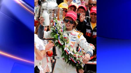 IndyCar driver Dan Wheldon, of England, celebrates with the traditional bottle of milk after winning the Indianapolis 500 auto race at the Indianapolis Motor Speedway in Indianapolis, Sunday, May 29, 2011. (AP Photo/Michael Conroy)