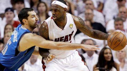 Miami Heats LeBron James (6) dribbles as Dallas Mavericks Peja Stojakovic (16) defends during the first half of Game 1 of the NBA Finals basketball game Tuesday, May 31, 2011, in Miami. (AP Photo/David J. Phillip)