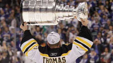 Boston Bruins goalie Tim Thomas hoists the Stanley Cup after the Boston Bruins beat the Vancouver Canucks 4-0 during Game 7 of the NHL hockey Stanley Cup Finals, Wednesday, June 15, 2011, in Vancouver, British Columbia. (AP Photo/Julie Jacobson)