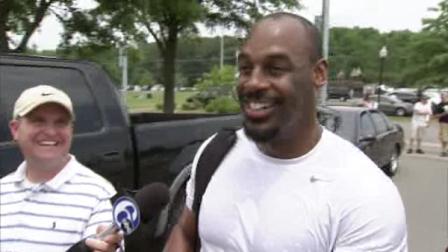Action News sports producer Mark Meany shares a laugh with former Philadelphia Eagles quarterback Donovan McNabb in South Jersey on June 22, 2011.