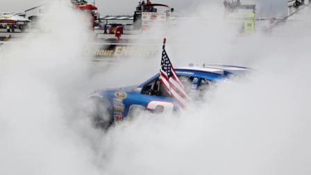 Brad Keselowski does a burnout after winning the NASCAR Sprint Cup Series auto race Sunday, Aug. 7, 2011, in Long Pond, Pa. (AP Photo/Mel Evans)