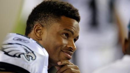 Philadelphia Eagles cornerback Nnamdi Asomugha (24) smiles as he sits on the bench in the second half of a preseason NFL football game with the Baltimore Ravens Thursday, Aug. 11, 2011, in Philadelphia. (AP Photo/Michael Perez)