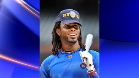 New York Mets shortstop Jose Reyes wears a New York Police Department cap during batting practice before the Mets baseball game against the Chicago Cubs at Citi Field in New York, Sunday, Sept. 11, 2011. (AP Photo/Kathy Kmonicek)