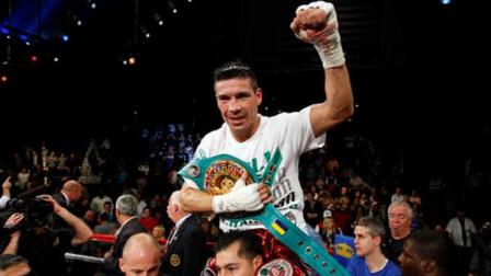 Sergio Martinez, background, of Oxnard, Calif., celebrates after knocking out Darren Barker, of London, England, in the 11th round of WBC World Middleweight Diamond Belt Championship Bout boxing match in Atlantic City, N.J., on Saturday, Oct. 1, 2011. Martinez won by knockout in the 11th round.