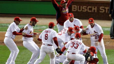 The St. Louis Cardinals celebrate after Texas Rangers David Murphy flies out to end Game 7 of baseballs World Series Friday, Oct. 28, 2011, in St. Louis. The Cardinals won 6-2 to win the series. (AP Photo/Paul Sancya)