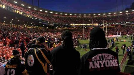 Fans stand at Candlestick Park after a power outage before an NFL football game between the San Francisco 49ers and the Pittsburgh Steelers in San Francisco, Monday, Dec. 19, 2011.