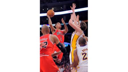 Chicago Bulls guard Derrick Rose (1) puts up a shot to give the Bulls the lead in the final seconds, as Los Angeles Lakers forward Pau Gasol defends during an NBA basketball game, Sunday, Dec. 25, 2011, in Los Angeles. The Bulls won 88-87. (AP Photo/Mark J. Terrill)
