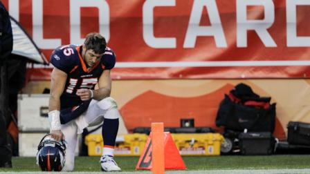 Denver Broncos quarterback Tim Tebow (15) kneels on the sidelines during the third quarter of an NFL wild card playoff football game against the Pittsburgh Steelers, Sunday, Jan. 8, 2012, in Denver. (AP Photo/Joe Mahoney)