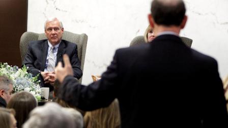 Penn State University President Rodney Erickson, left, listens to a question from an alumnus during a town hall meeting with alumni in Pittsburgh, Wednesday, Jan. 11, 2012. (AP Photo/Gene J. Puskar)