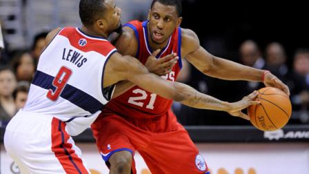 Washington Wizards forward Rashard Lewis (9) tries to get the ball away from Philadelphia 76ers forward Thaddeus Young (21) during the second half of an NBA basketball game, Saturday, Jan. 14, 2012, in Washington. The 76ers won 103-90. (AP Photo/Nick Wass)