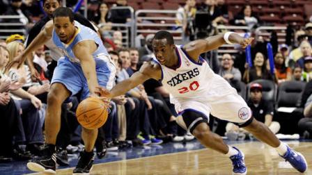 Denver Nuggets Andre Miller, left, and Philadelphia 76ers Jodie Meeks (20) chase after a loose ball in the second half of an NBA basketball game, Wednesday, Jan. 18, 2012, in Philadelphia. Denver won 108-104 in overtime. (AP Photo/Matt Slocum)