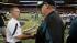 St. Louis Rams head coach Steve Spagnuolo, left,...