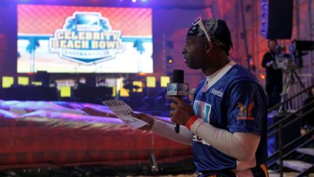 Former football player Deion Sanders does an interview before the Celebrity Beach Bowl, part of NFL footballs Super Bowl XLVI festivities, Saturday, Feb. 4, 2012, in Indianapolis. (AP Photo/Jeff Roberson)