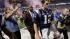 New England Patriots quarterback Tom Brady walks...