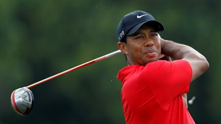 Tiger Woods watches his shot from the third tee, during the final round of the Cadillac Championship golf tournament, Sunday, March 11, 2012, in Doral, Fla. (AP Photo/Lynne Sladky)