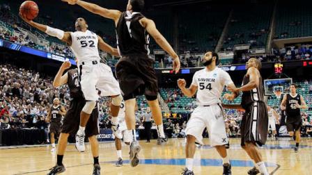 Xaviers Tu Holloway (52) drives past Lehighs John Adams (4) during the second half of a third-round NCAA tournament college basketball game in Greensboro, N.C., Sunday, March 18, 2012. (AP Photo/Gerry Broome)