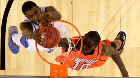 Kentucky forward Michael Kidd-Gilchrist (14) slam dunks over Louisville center Gorgui Dieng (10) during the second half of an NCAA Final Four semifinal college basketball tournament game Saturday, March 31, 2012, in New Orleans. Kentucky won 69-61.(AP Photo/Mark Humphrey)