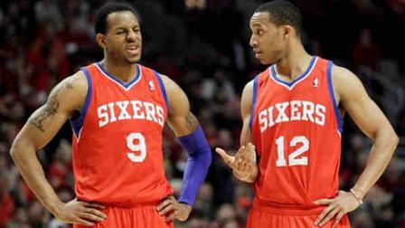Philadelphia 76ers forward Andre Iguodala (9) reacts as he listens to guard Evan Turner (12) during the first half of Game 1 in the first round of the NBA basketball playoffs in Chicago, Saturday, April 28, 2012. (AP Photo/Nam Y. Huh)