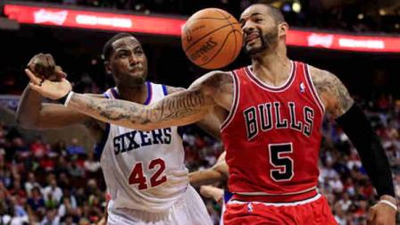 Chicago Bulls Carlos Boozer (5) loses the ball as he is defended by Philadelphia 76ers Elton Brand (42) during the first quarter of Game 3 in an NBA basketball first-round playoff series in Philadelphia, Friday, May 4, 2012. (AP Photo/Mel Evans)